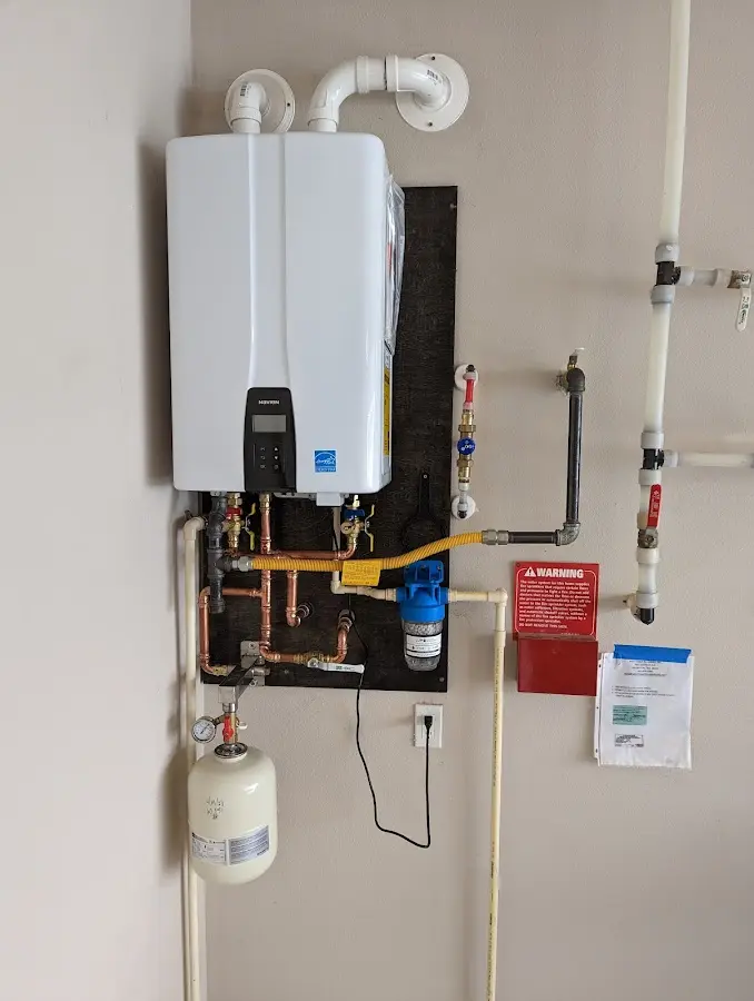 Professional plumber installing copper piping in a Lake Magdalene home